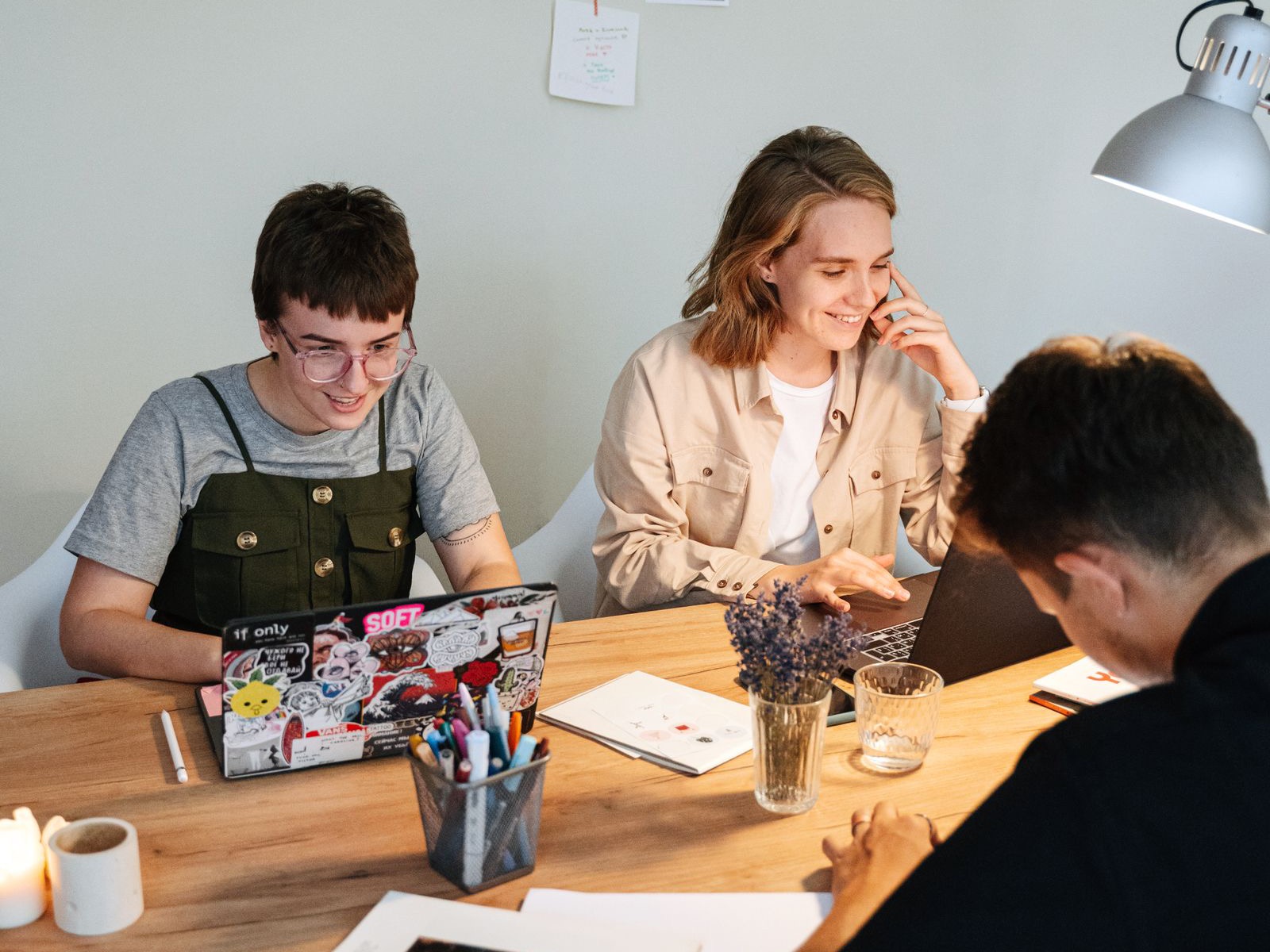 Team members brainstorming together at a shared desk