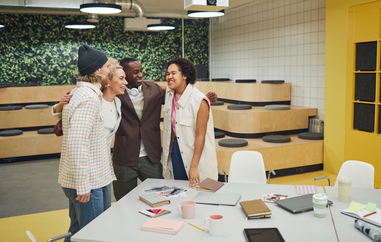Teammates sharing a laugh together in the office