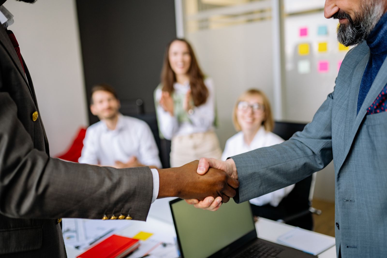 Shaking hands with a client after a project kickoff