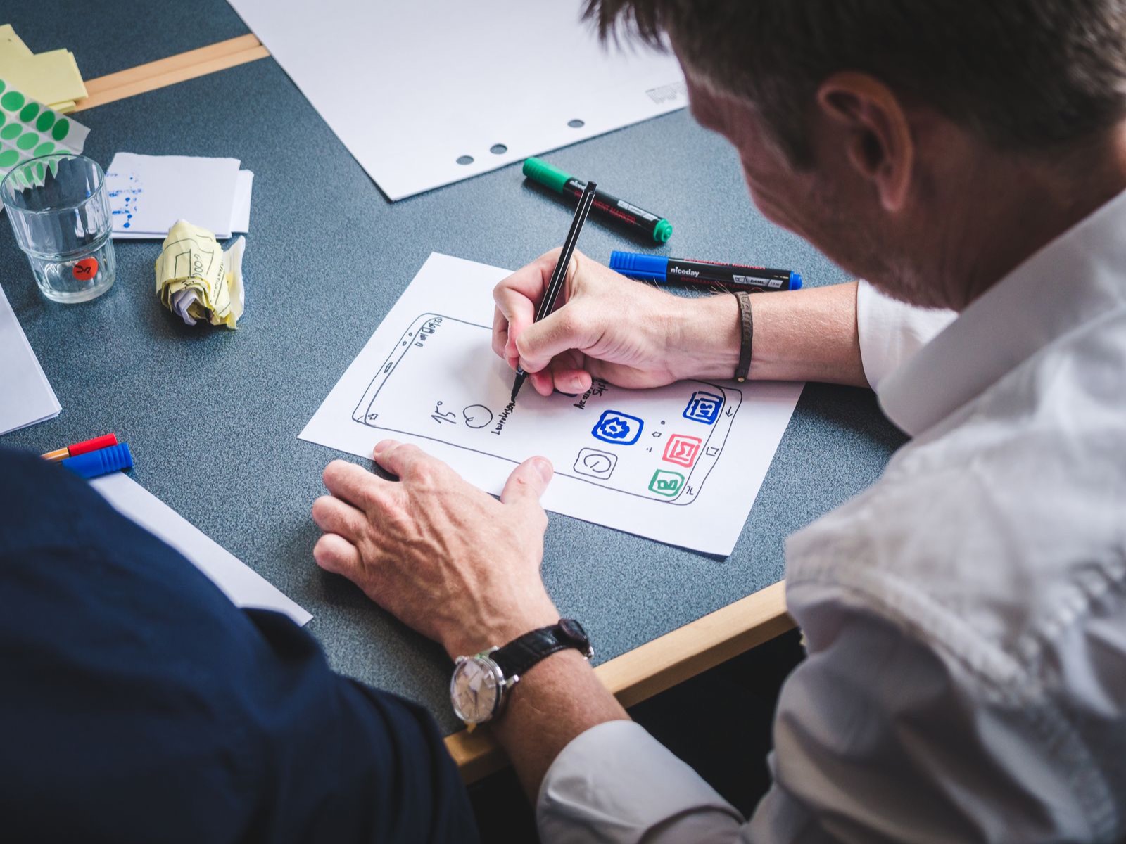 Designer sketching a mobile app interface